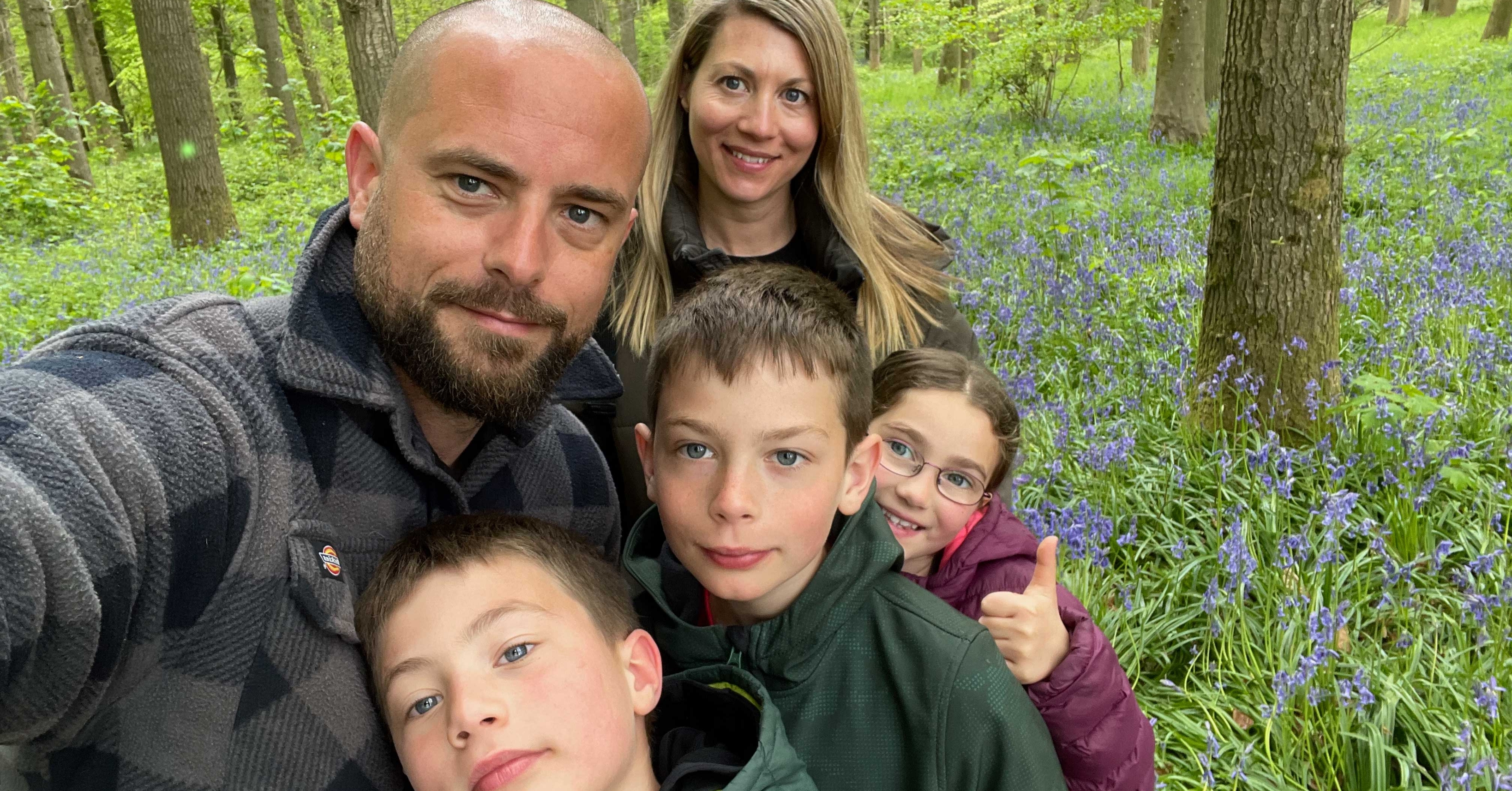 Dave with his family on a woodland walk